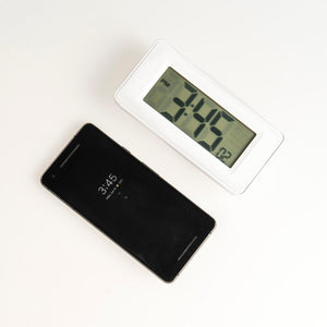 Meditation timer compared with an average-sized smartphone for scale